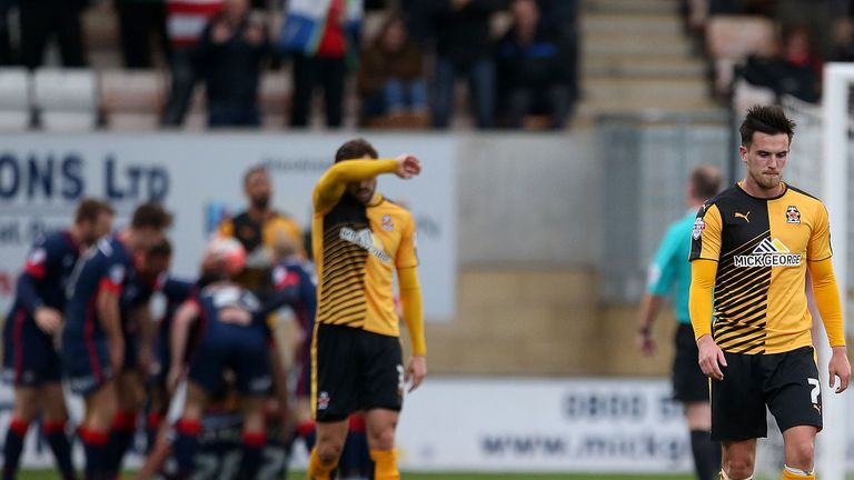 Cambridge are dejected as Doncaster celebrate