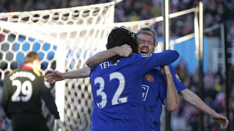 Manchester United's Argentinian player Carlos Tevez (front) celebrates his goal against Stoke City with Paul Scholes of Manchester United  during a Premier