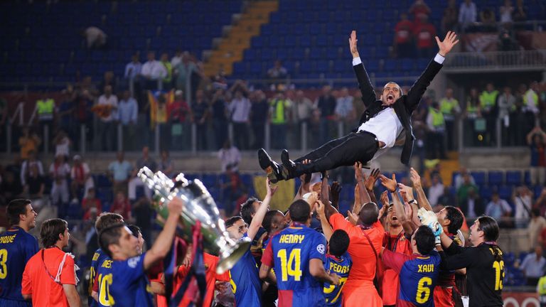 ROME - MAY 27:  Josep Guardiola coach of Barcelona is  thrown into the air by his players as they celebrate winning the UEFA Champions League Final match b