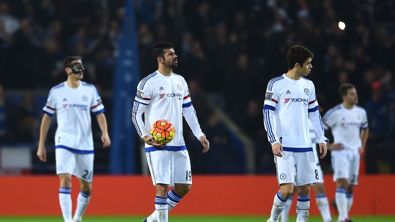 Dejected Chelsea players look on after defeat to Leicester