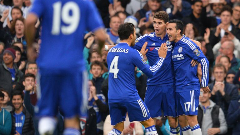 Chelsea's Pedro (R) celebrates with Oscar (C) and Cesc Fabregas
