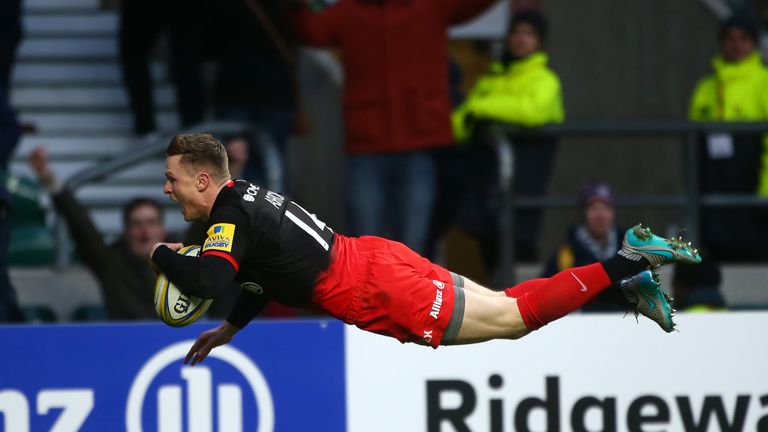 Chris Ashton of Saracens dives to score the first try of the game with team during the Aviva Premiership match between Saracens and Worcester Warriors