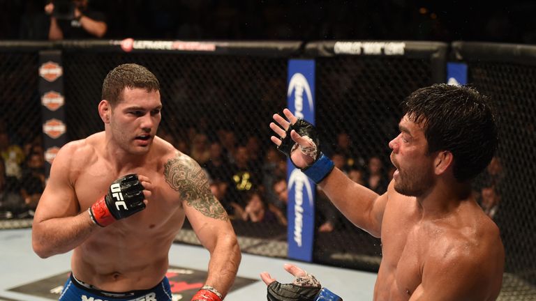 UFC middleweight champion Chris Weidman punches Lyoto Machida