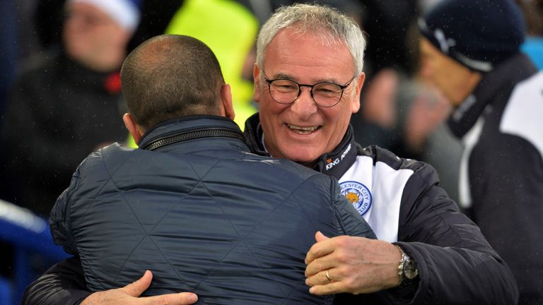 Leicester City's Italian manager Claudio Ranieri (R) greets Everton's Spanish manager Roberto Martinez (L)