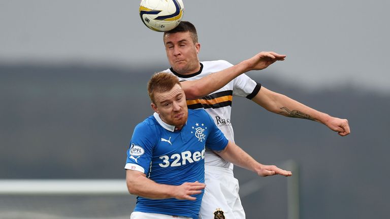 Cowdenbeath player/manager Colin Nish challenging Steven Smith of Rangers last season.