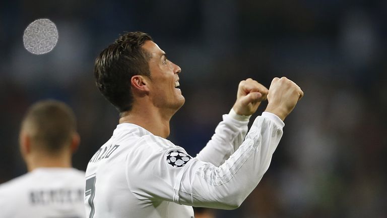 Cristiano Ronaldo celebrates after scoring his team's fifth goal during the UEFA Champions League Group A match between Real Madrid and Malmo