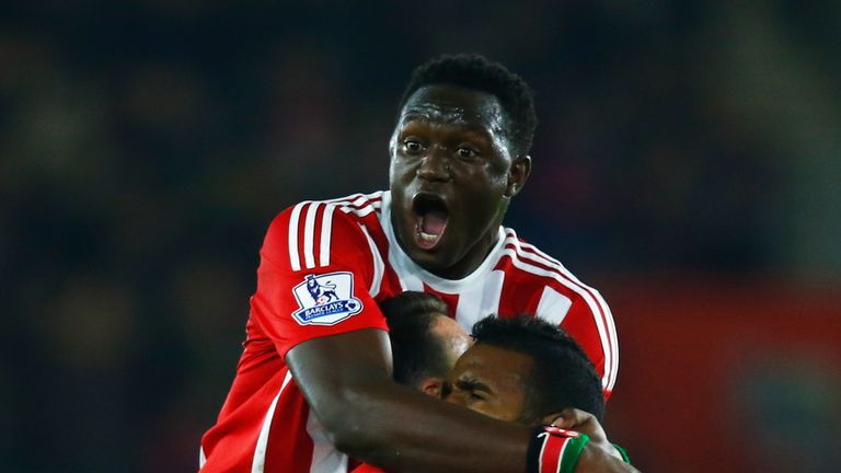 Cuco Martina celebrates with Victor Wanyama and Jose Fonte