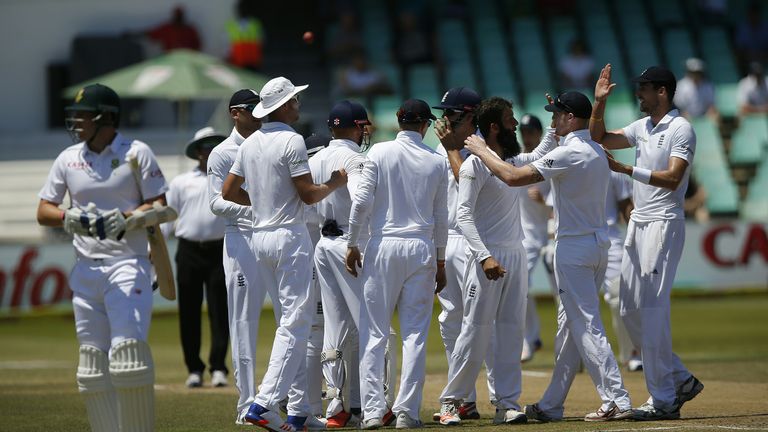 England team players celebrate after dismissing South African batsman Dale Steyn