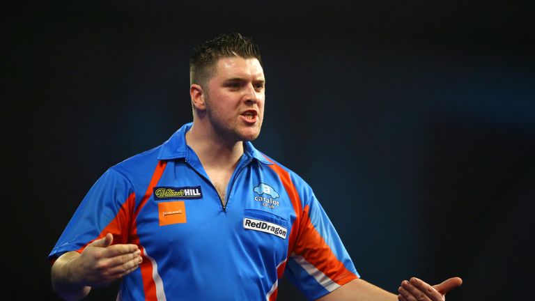 Daryl Gurney celebrates victory over Jamie Lewis during the first round on day one of the 2016