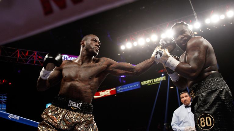 LAS VEGAS, NV - JANUARY 17:  Deontay Wilder (L) connects on WBC heavyweight champion Bermane Stiverne