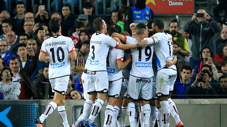 Deportivo players celebrate after snatching point