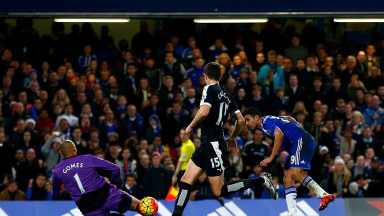 Costa guides his shot past Gomes to make it 2-2 at Stamford Bridge