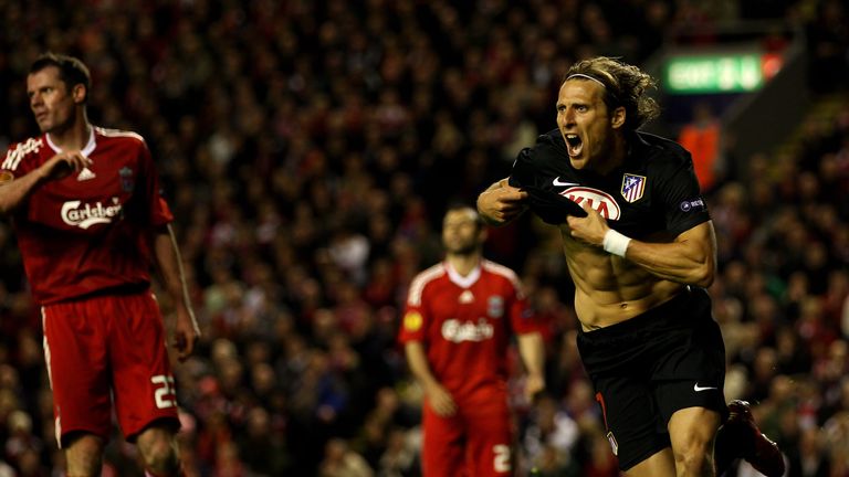 Diego Forlan of Atletico Madrid celebrates scoring his team's first goal in extra time 