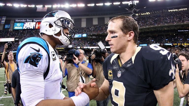 Cam Newton #1 of the Carolina Panthers is congartulated by Drew Brees #9