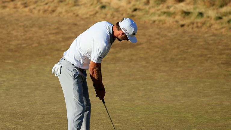 Dustin Johnson of the United States watches his missed birdie putt on the 18th green during the final round of the 115th US Open