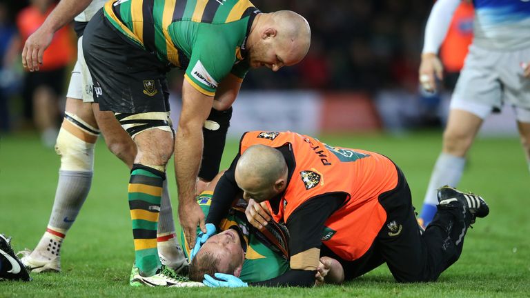 NORTHAMPTON, ENGLAND - NOVEMBER 07:  Dylan Hartley of Northampton receives attention to a head injury during the Aviva Premiership match between Northampto