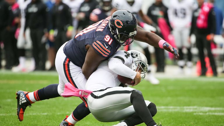 Eddie Goldman #91 of the Chicago Bears sacks quarterback Derek Carr #4 of the Oakland Raiders