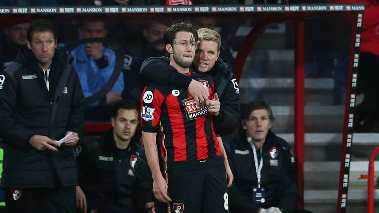 Bournemouth manager Eddie Howe embraces Harry Arter as they stand in the technical area