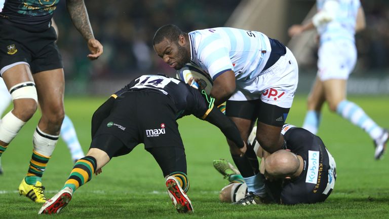 Eddy Ben Arous of Racing 92 is tackled by Jamie Elliott (L) and Sam Dickinson during the Champions Cup match between Northampton Saints and Racing 92