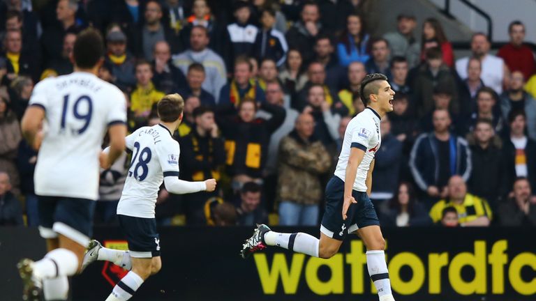 Erik Lamela (R) celebrates scoring Tottenham's first goal during the Barclays Premier League match against Watford