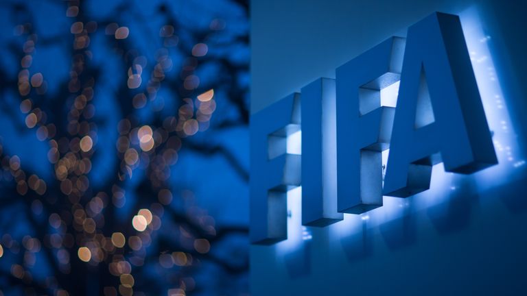 An illuminated FIFA logo sits on a sign at the FIFA headquarters on December 3, 2015 in Zurich, Switzerland. 