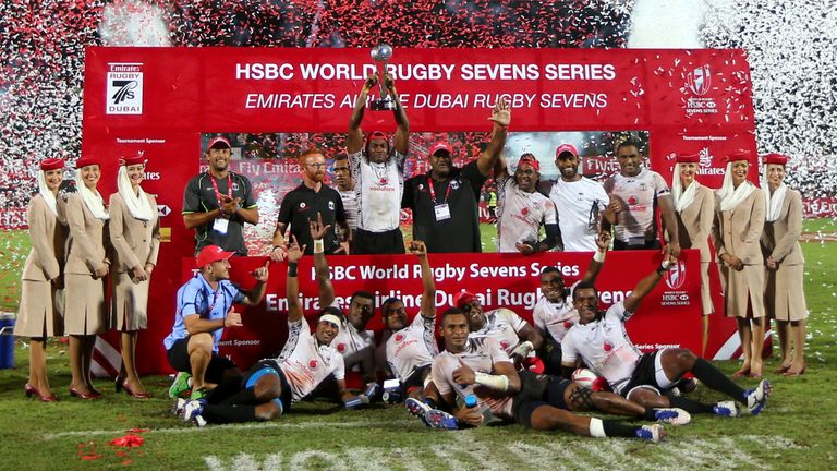 Fiji players celebrate after beating England in their final rugby match on the second day of the Dubai leg of the IRB's World Rugby Sevens Series 2015