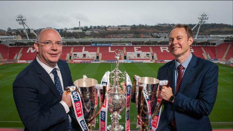 Football League chief executive Shaun Harvey and Sky Bet chief executive Richard Flint with the Football League's three trophies