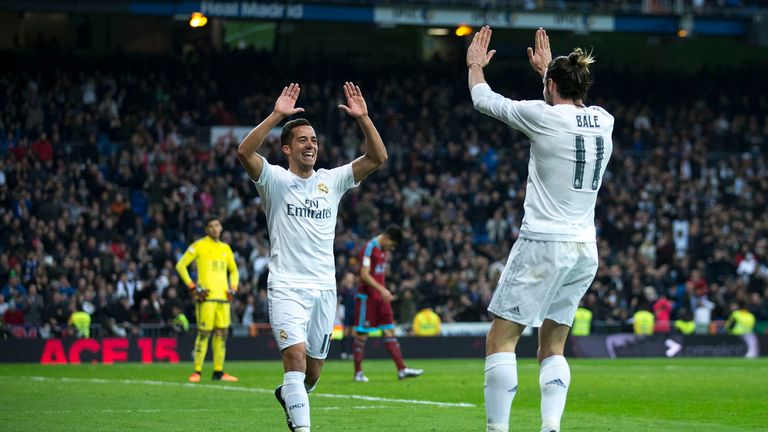 Lucas Vazquez (L) of Real Madrid celebrates scoring their third goal with team-mate Gareth Bale (R)