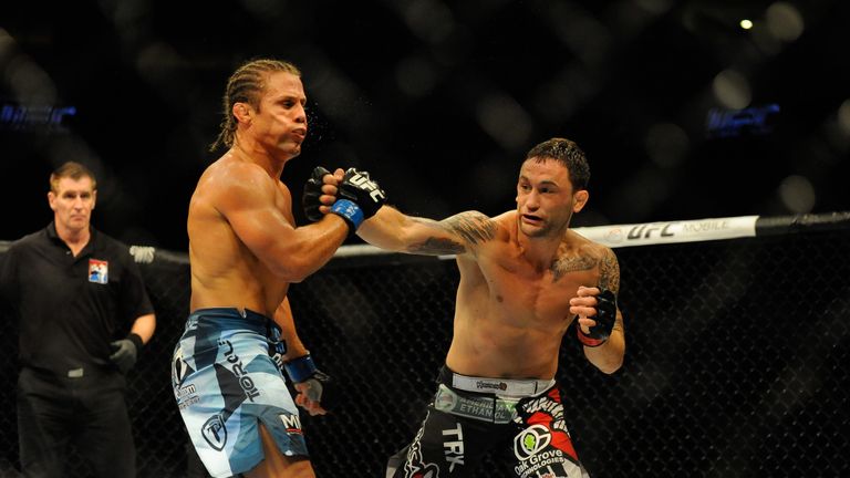 MANILA, PHILIPPINES - MAY 16:  Uriah Faber (L) grapples with Frankie Edgar in their featherweight bout during the UFC Fight Night