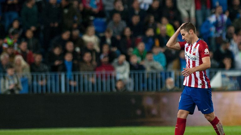 Atletico Madrid's midfielder Gabi reacts after receiving a red card