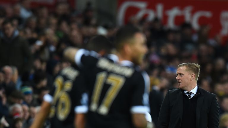 Swansea manager Garry Monk reacts as Leicester celebrate their second goal