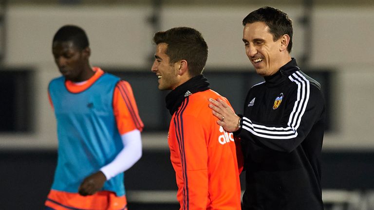 VALENCIA, SPAIN - DECEMBER 07:  Gary Neville (R) the new manager of Valencia CF reacts to his player Jose Gaya during a training session ahead of Wednesday