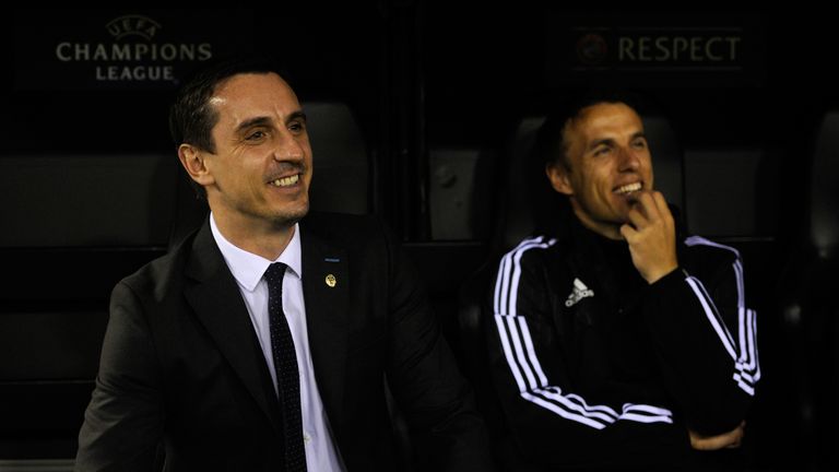 Gary Neville (left) and brother Phil are all smiles before Valencia's clash against Lyon