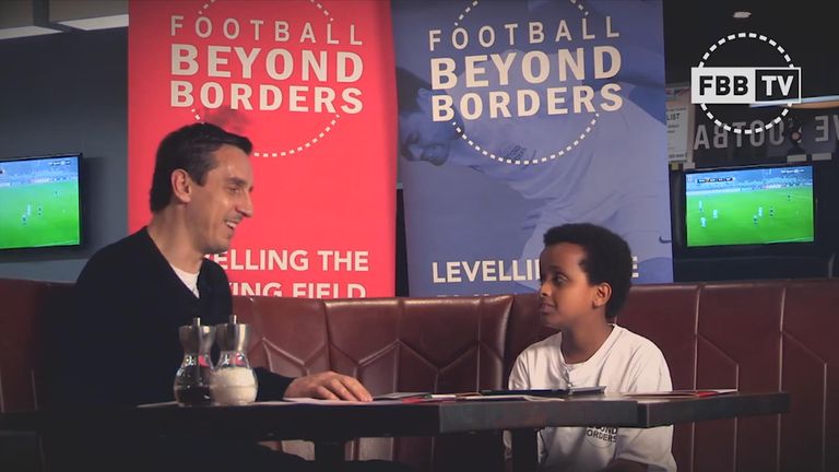 Gary Neville talks to 13-year-old Rashad for charity Football Beyond Borders.