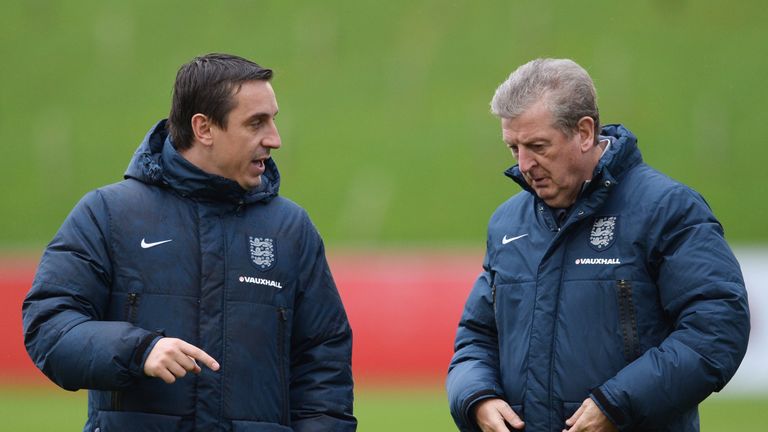BURTON-UPON-TRENT, ENGLAND - NOVEMBER 14:  Roy Hodgson manager of England (R) and coach Gary Neville in discussion during an England training session, ahea