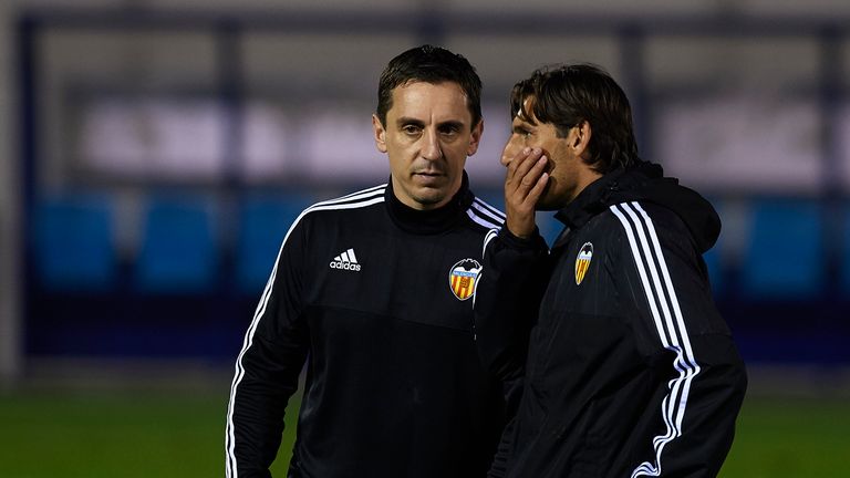VALENCIA, SPAIN - DECEMBER 07:  Gary Neville (L) the new manager of Valencia CF talks to Valencia CF assistant Miguel Angel Angulo