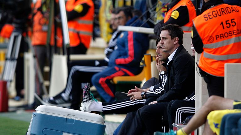 Valencia's coach Gary Neville watches the game on the sideline