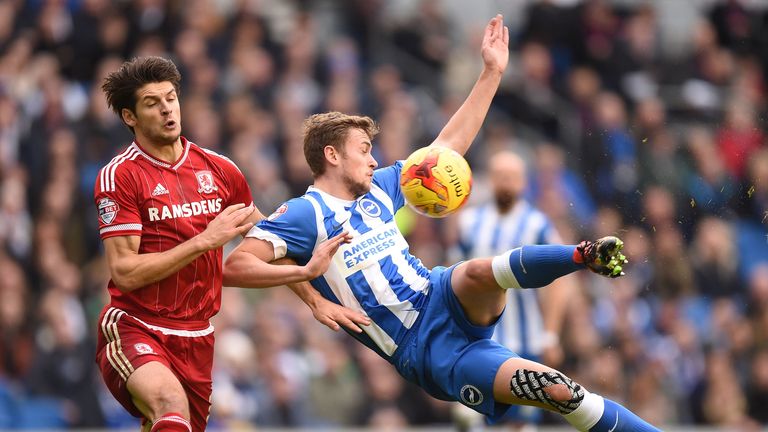 Middlesbrough's George Friend (left) and Brighton's James Wilson battle for the ball