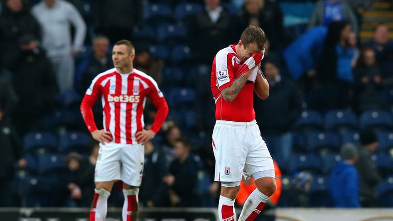  A dejected Glenn Whelan of Stoke City wipes his face after Blackburn scored a third goal 