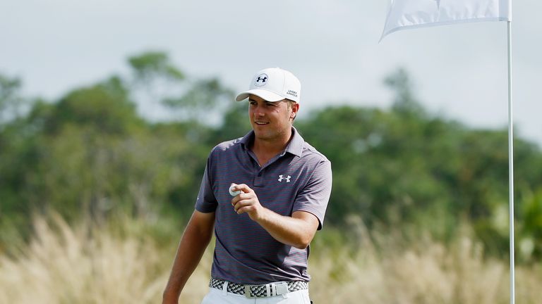 Jordan Spieth soaks up the applause after being the ball out of the hole following his ace at the second