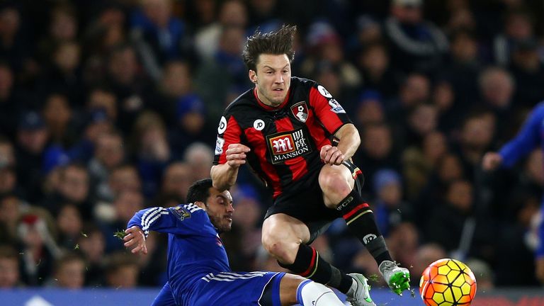 Harry Arter of Bournemouth is tackled by Pedro of Chelsea 