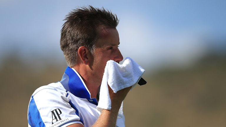 Henrik Stenson cools off after losing his temper on the final hole of his third round in Sun City