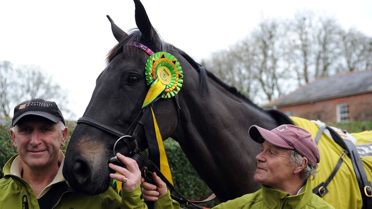Trainer Oliver Sherwood (left) poses for a photograph next to 2015 Crabbies Grand National Winner Many Clouds during a media day at Oliver Sherwood's Stabl