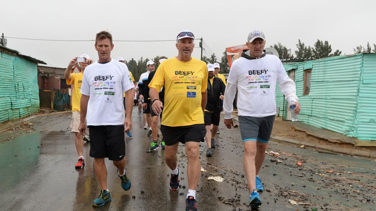 STELLENBOSCH, SOUTH AFRICA - DECEMBER 12:  In this handout image provided by Philip Brown, Sir Ian Botham, Allan Donald (R) and his supporters walk the 'Be
