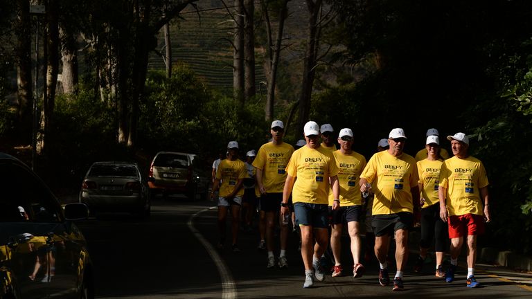 CAPE TOWN, SOUTH AFRICA - DECEMBER 11:  In this handout image provided by Philip Brown, Sir Ian Botham and his supporters walk the 'Beefy Walking the Rainb