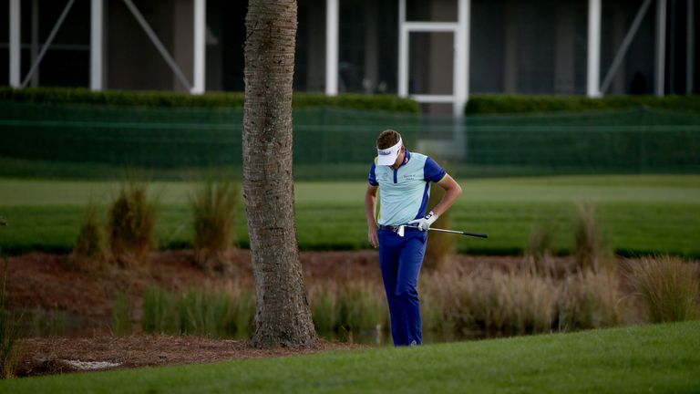 PALM BEACH GARDENS, FL - MARCH 02:  Ian Poulter of England lowers is head on the 14th hole during the continuation of the fourth round of The Honda Classic