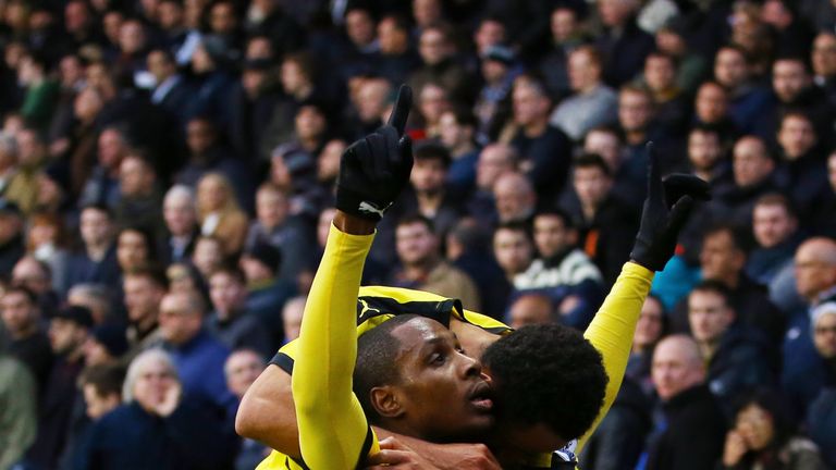 Odion Ighalo (R) of Watford celebrates scoring his team's first goal with his team mate Ikechi Anya (L) during the games against Tottenham