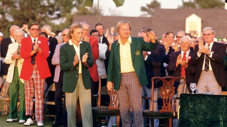 Bernhard Langer hands the Green Jacket over to Nicklaus after his victory