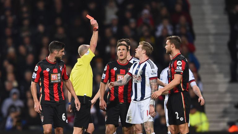 James McClean of West Bromwich Albion is shown a red card against Bournemouth by referee Mike Dean 