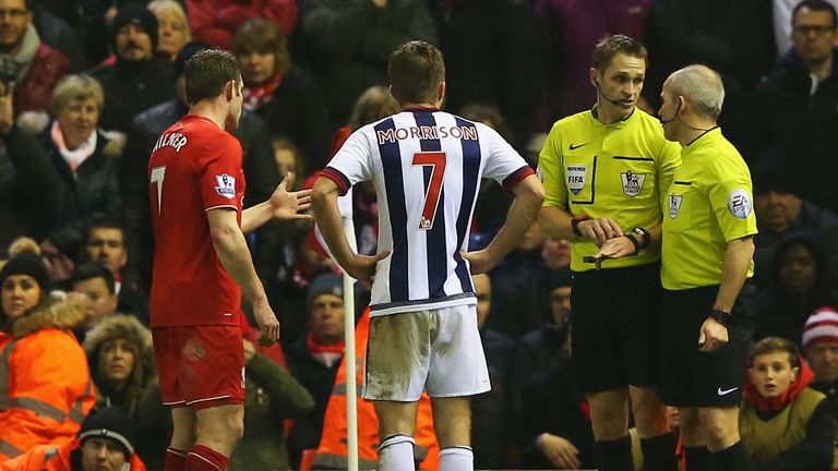 James Milner and James Morrison look on as the official deliberate over a controversial offside decision